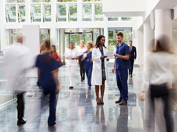 medical staff in busy hospital reception area